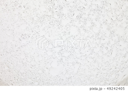 Rain droplets on glass background. Rain droplets on glass background. 49242405