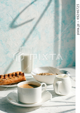Breakfast from oatmeal with milk and cup of black 49246725