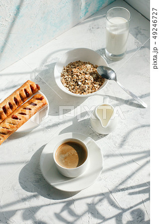 Breakfast from oatmeal with milk and cup of black 49246727