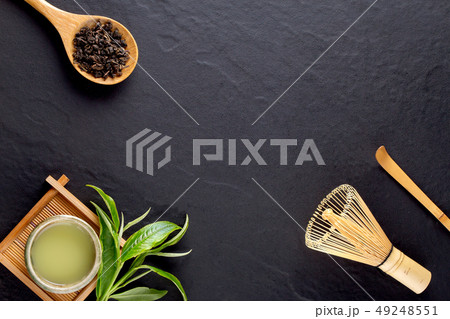 Top view of green tea matcha in a bowl on wooden Top view of green tea matcha in a bowl on wooden 49248551