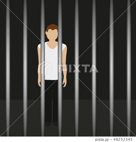 man in a prison behind jail bars 49252345
