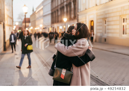 Close-up photo of two emotional woman friends hugging each other 49254832