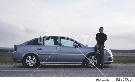 Handsome man near the car. Luxury life. 49255009