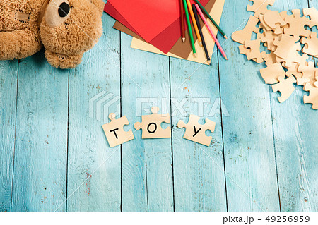 Concept of business, mock up and pieces of puzzles on the background of wooden table Concept of business, mock up and pieces of puzzles on the background of wooden table 49256959