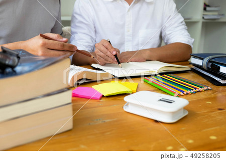 Students helps friend teaching and learning. 49258205