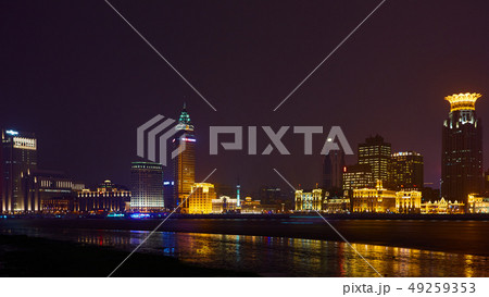 Shanghai, China - March 12, 2016: The Bund it is a waterfront area which runs along the western bank Shanghai, China - March 12, 2016: The Bund it is a waterfront area which runs along the western bank 49259353