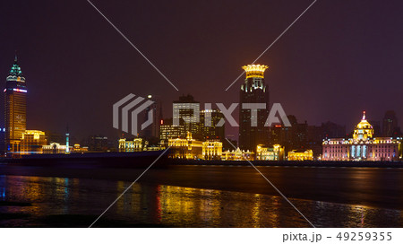 Shanghai, China - March 12, 2016: The Bund it is a waterfront area which runs along the western bank Shanghai, China - March 12, 2016: The Bund it is a waterfront area which runs along the western bank 49259355