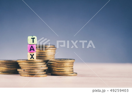 colorful cube with word TAX and stacking coin colorful cube with word TAX and stacking coin 49259403