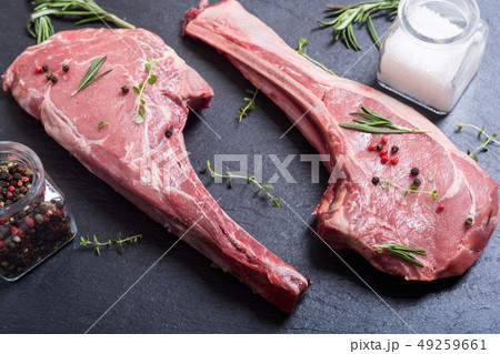 Raw beef tomahawk steak 49259661