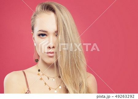 Young woman face on pink background 49263292