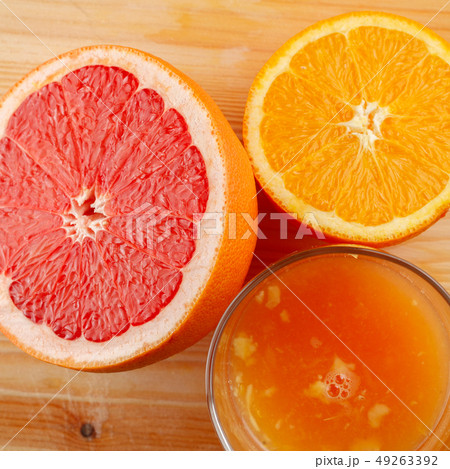 a glass of freshly-squeezed citrus juice 49263392