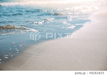 Summer sand beach and seashore waves background 49263825
