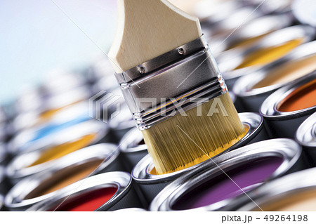 Metal tin cans with color paint and paintbrush 49264198