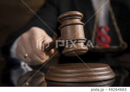 Judge, male judge in a courtroom striking the 49264663
