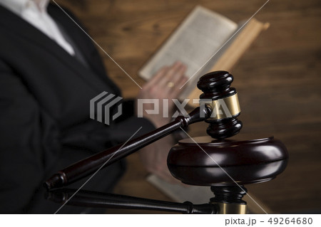 Judge, male judge in a courtroom striking the 49264680