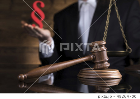 Judge, male judge in a courtroom striking the 49264700