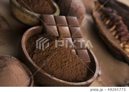 Cocoa beans and chocolate on natural paper Cocoa beans and chocolate on natural paper 49265773