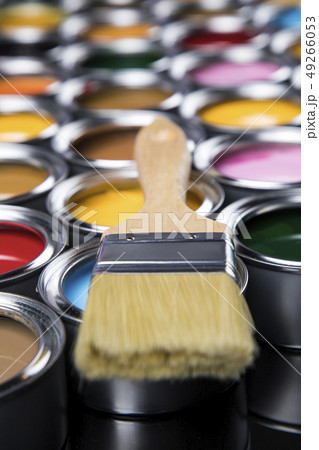 Metal tin cans with color paint and paintbrush 49266053