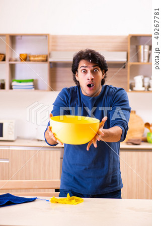 Young man in water leakage from the neighbors concept Young man in water leakage from the neighbors concept 49267781