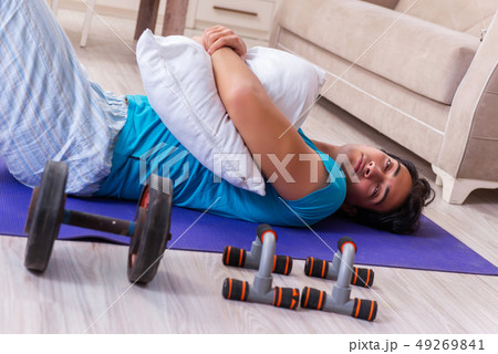 Young handsome man doing morning exercises Young handsome man doing morning exercises 49269841
