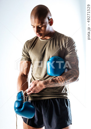 Man wearing boxing gloves before boxing training 49271529