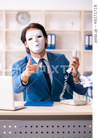 Male employee in the office in industrial espionage concept Male employee in the office in industrial espionage concept 49271718