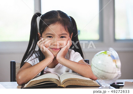 Back to school. Cute asian child girl with a book 49272633