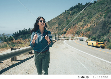 woman in trendy sunglasses in side of highway 49273668