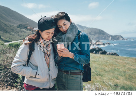 people hiking in countryside seascape in Big Sur 49273702