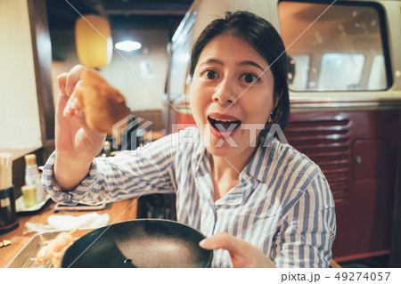 woman showing delicious japanese kushiage snack 49274057