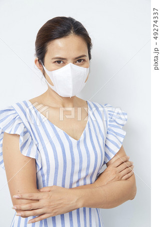 Asian woman wearing face mask Asian woman wearing face mask 49274337