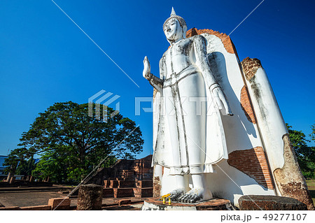 Ancient white buddha statue beautiful at sunset is Ancient white buddha statue beautiful at sunset is 49277107