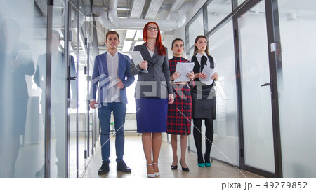 A successful business people walking through the corridor 49279852