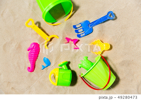 close up of sand toys kit on summer beach close up of sand toys kit on summer beach 49280473