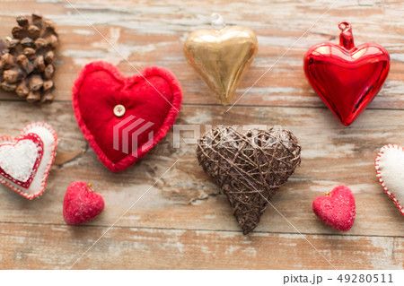 heart shaped decorations on wooden background 49280511