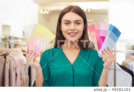 woman with color swatches at clothing store 49281101