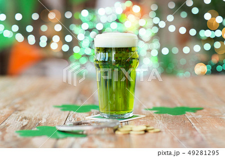 glass of green beer, horseshoe and golden coins glass of green beer, horseshoe and golden coins 49281295