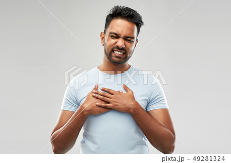 unhappy indian man suffering from heartache unhappy indian man suffering from heartache 49281324