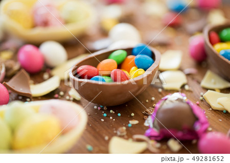 chocolate easter eggs and candy drops on table 49281652