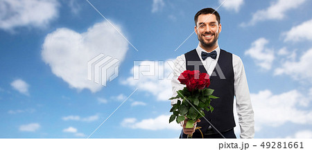 happy man with bunch of red roses happy man with bunch of red roses 49281661