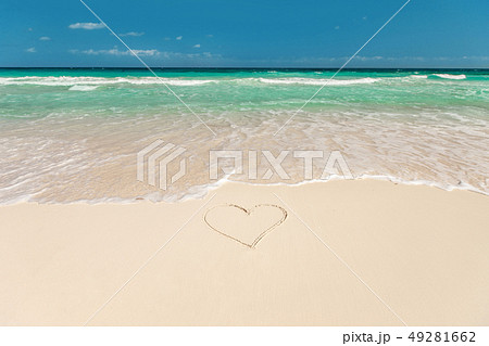 tropical beach with heart on sand 49281662