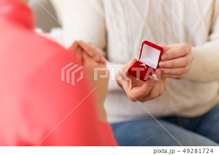 man giving diamond ring to woman on valentines day man giving diamond ring to woman on valentines day 49281724