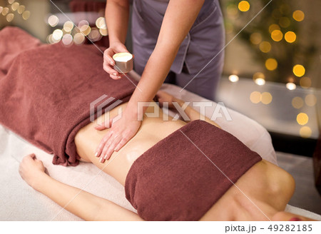 woman lying and having massage with hot oil at spa 49282185