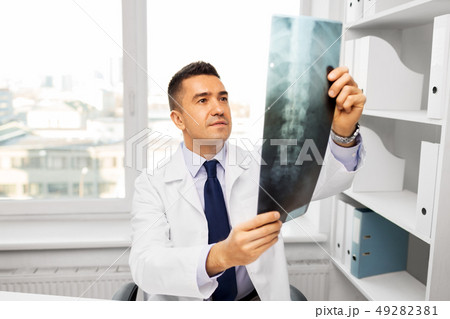 doctor with x-ray scan at hospital doctor with x-ray scan at hospital 49282381