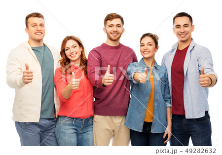 group of smiling friends showing thumbs up group of smiling friends showing thumbs up 49282632