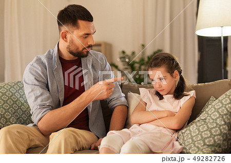 upset or feeling guilty girl and father at home upset or feeling guilty girl and father at home 49282726