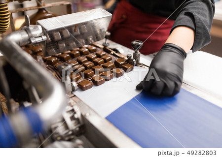 candies making by chocolate coating machine candies making by chocolate coating machine 49282803