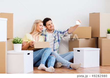 couple taking selfie and moving to new home couple taking selfie and moving to new home 49282980