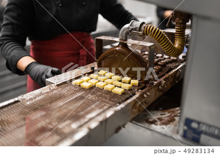 candies making by chocolate coating machine candies making by chocolate coating machine 49283134