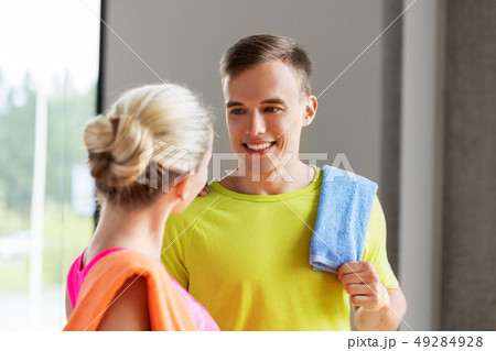 happy couple with towels in gym happy couple with towels in gym 49284928